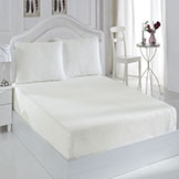 Woven or knitted fitted sheets